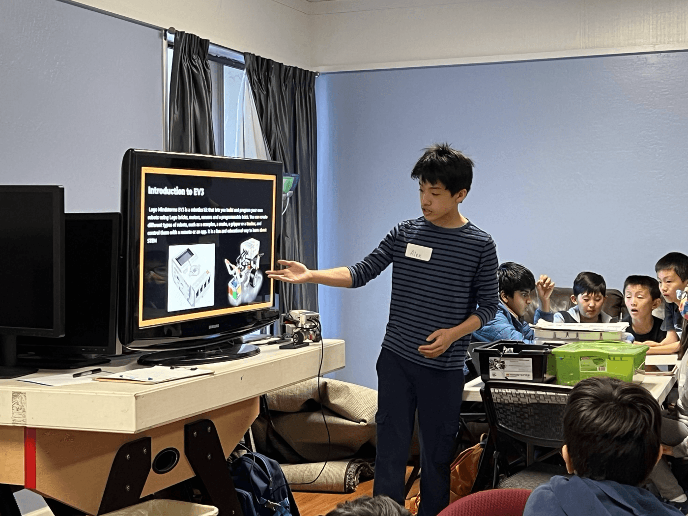 BASA student leader teaching a robotics lesson